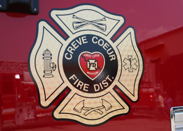 Creve Coeur fire district logo on red vehicle