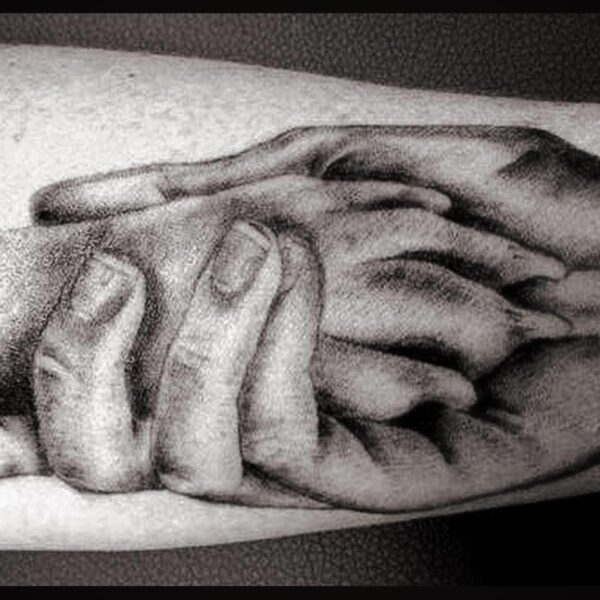 Hand drawn picture of a person holding a dog's paw